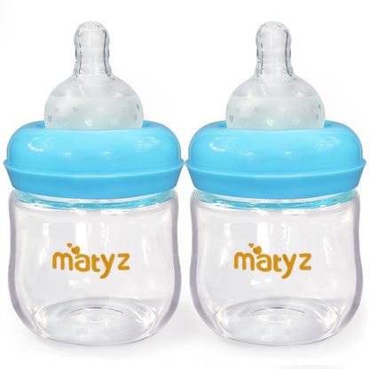 Matyz 2-Pack Glass Baby Breastfeeding Bottles with Caps (Blue 4Oz) - Wide Neck New Born Bottles for Baby Breastfeeding - 4 Oz Glass Baby Bottles with Lids - Breastfeeding Bottles for Newborn Babies